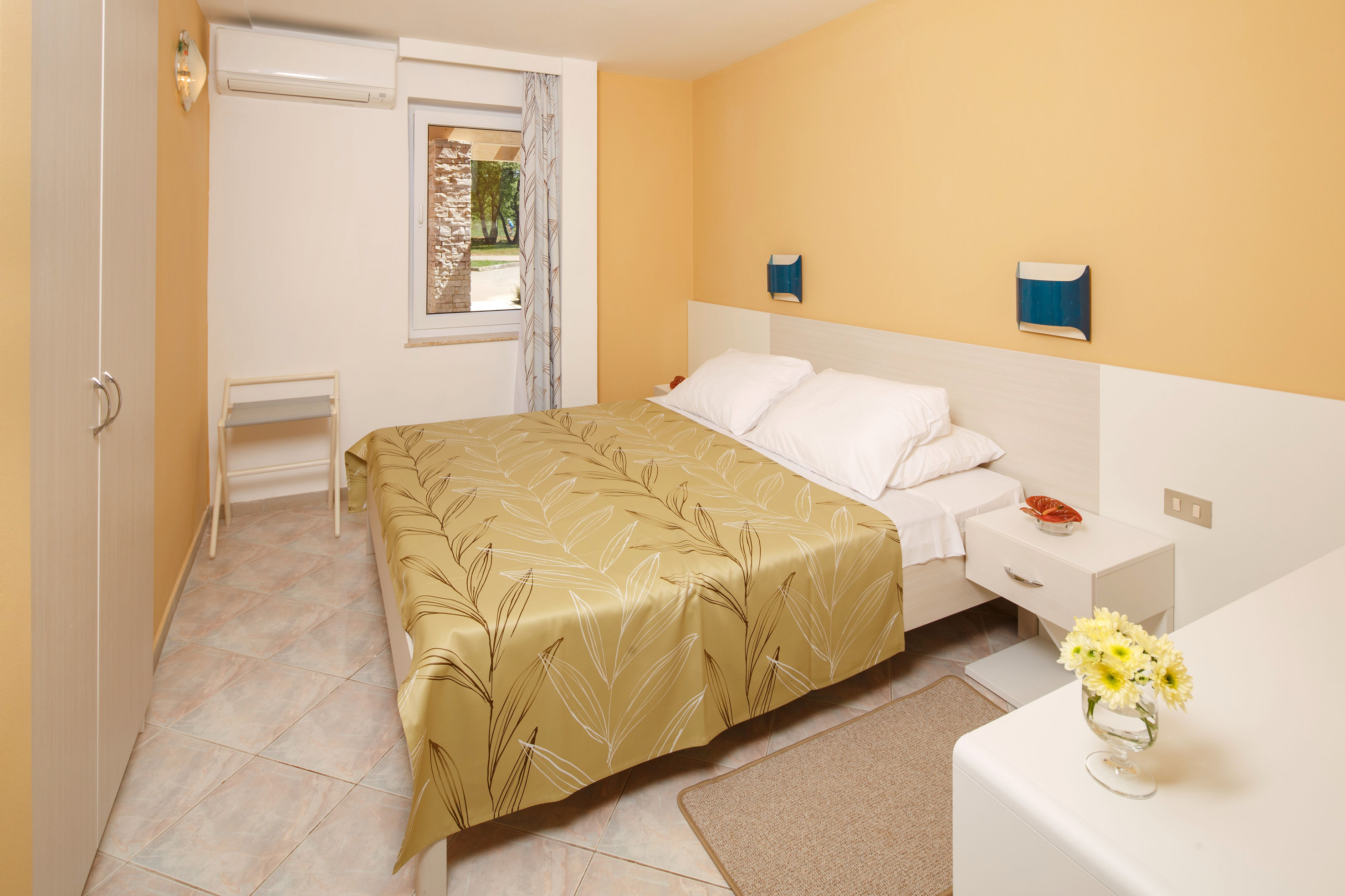a bedroom with a bed and a table