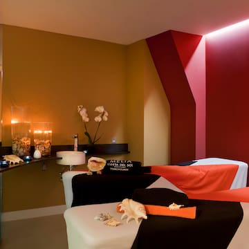 a massage room with a red and black towel