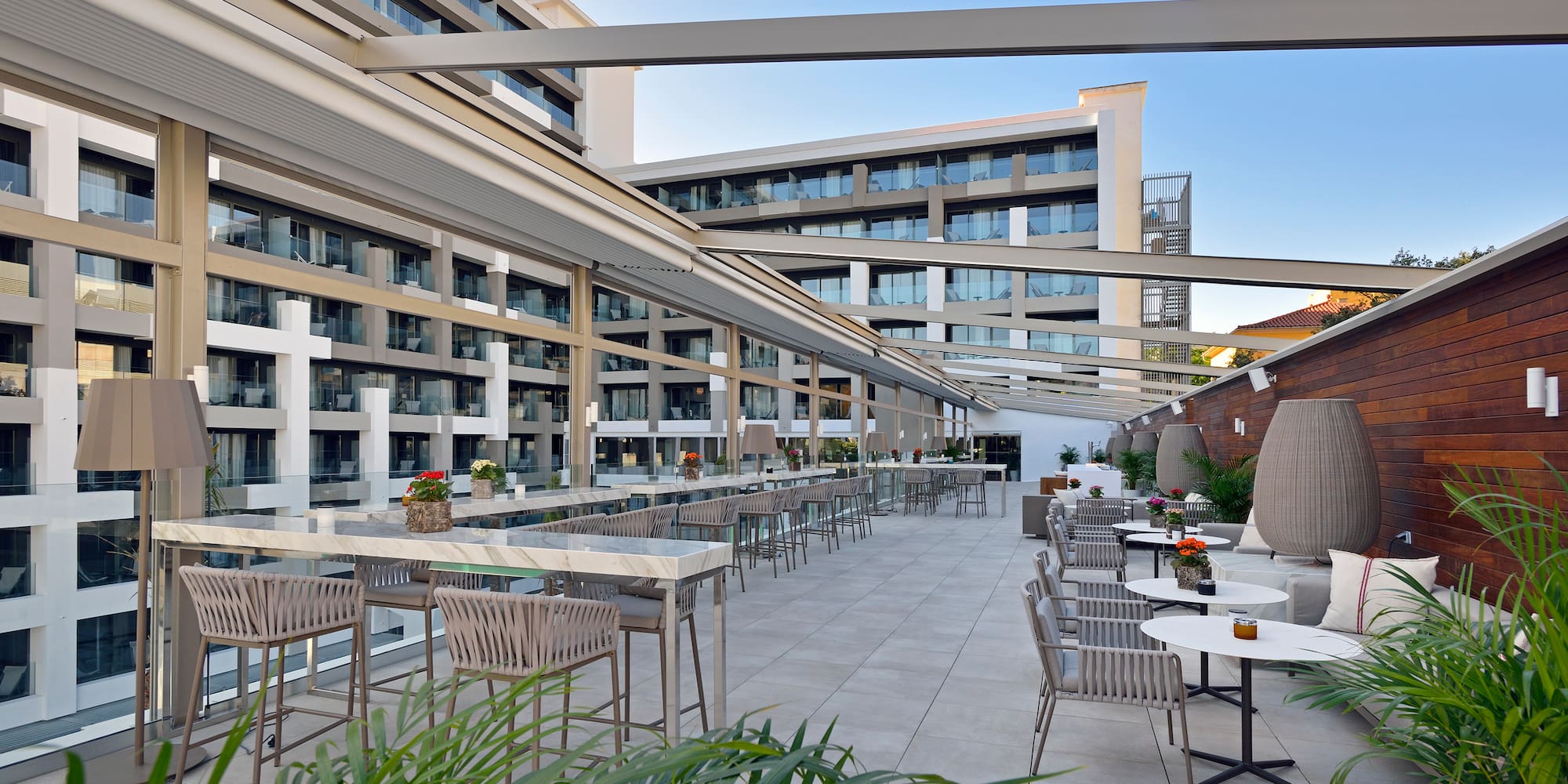 a patio with tables and chairs