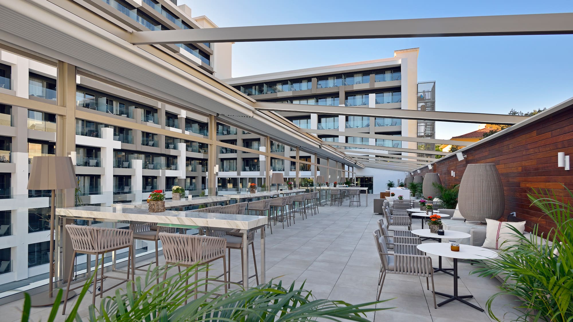a patio with tables and chairs