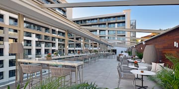 a patio with tables and chairs