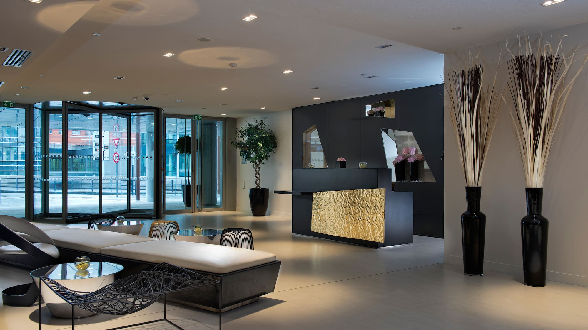 a lobby with a reception desk and a table
