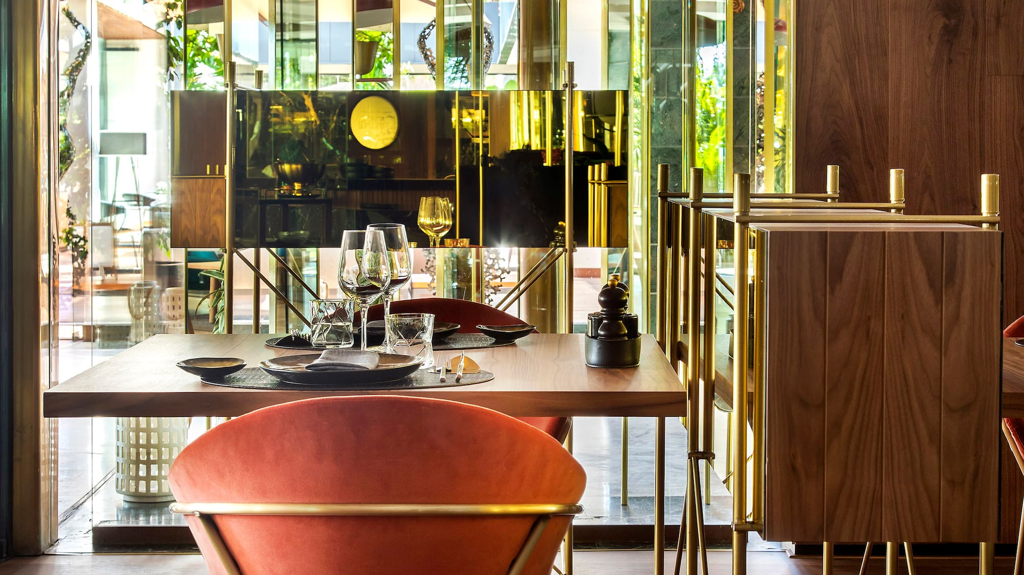 a dining room with a table and chairs