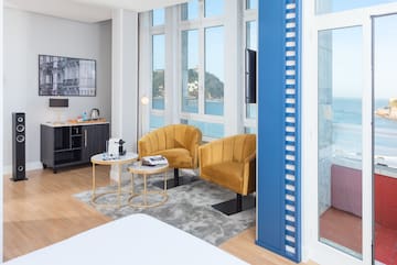 a room with two chairs and a tv