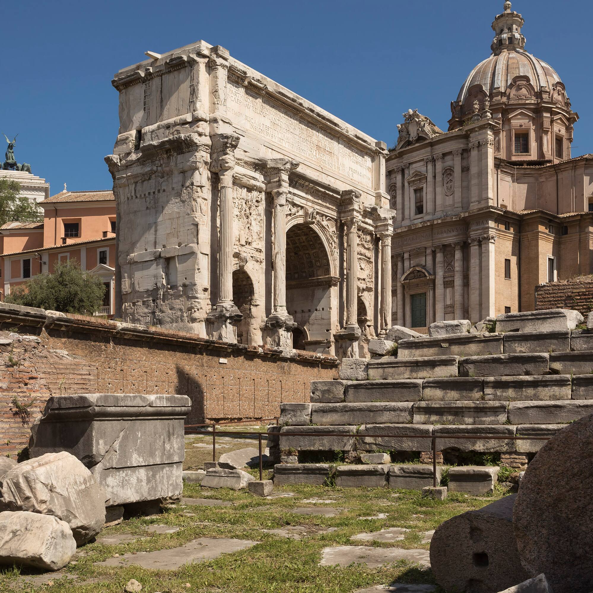 a stone steps and a stone arch in front of a building