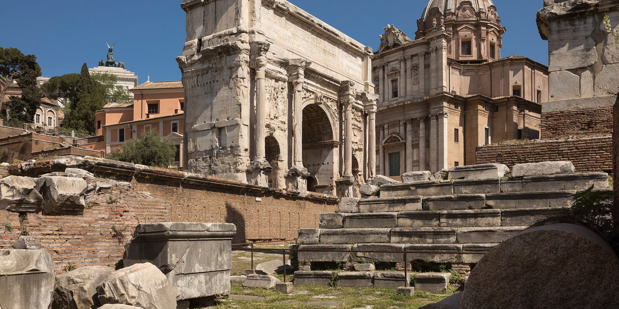 a stone steps and a stone arch in front of a building