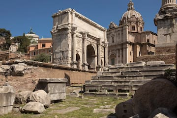 a stone steps and a stone arch in front of a building