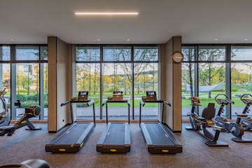 a room with treadmills and a clock
