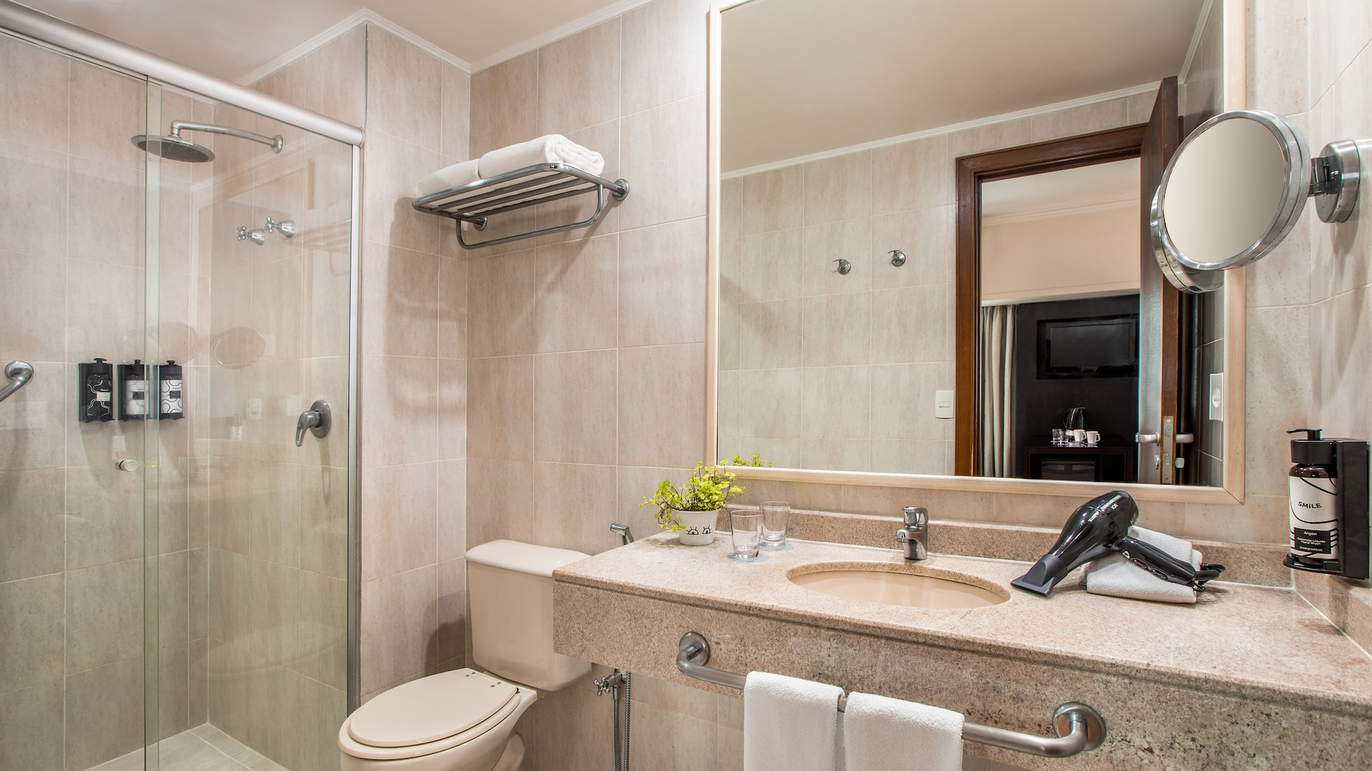 a bathroom with a shower and sink