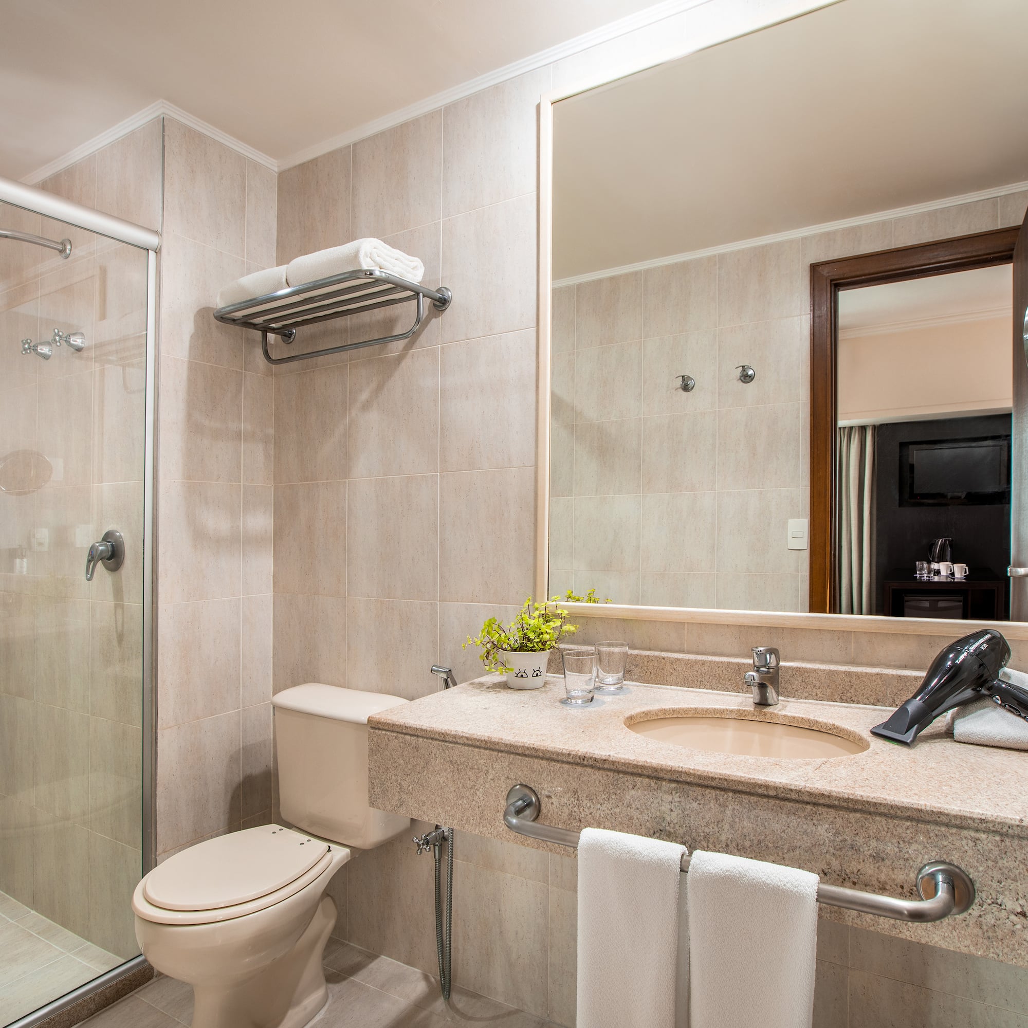 a bathroom with a shower and sink