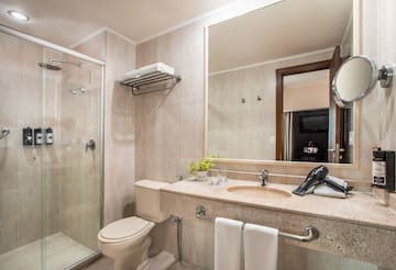 a bathroom with a shower and sink