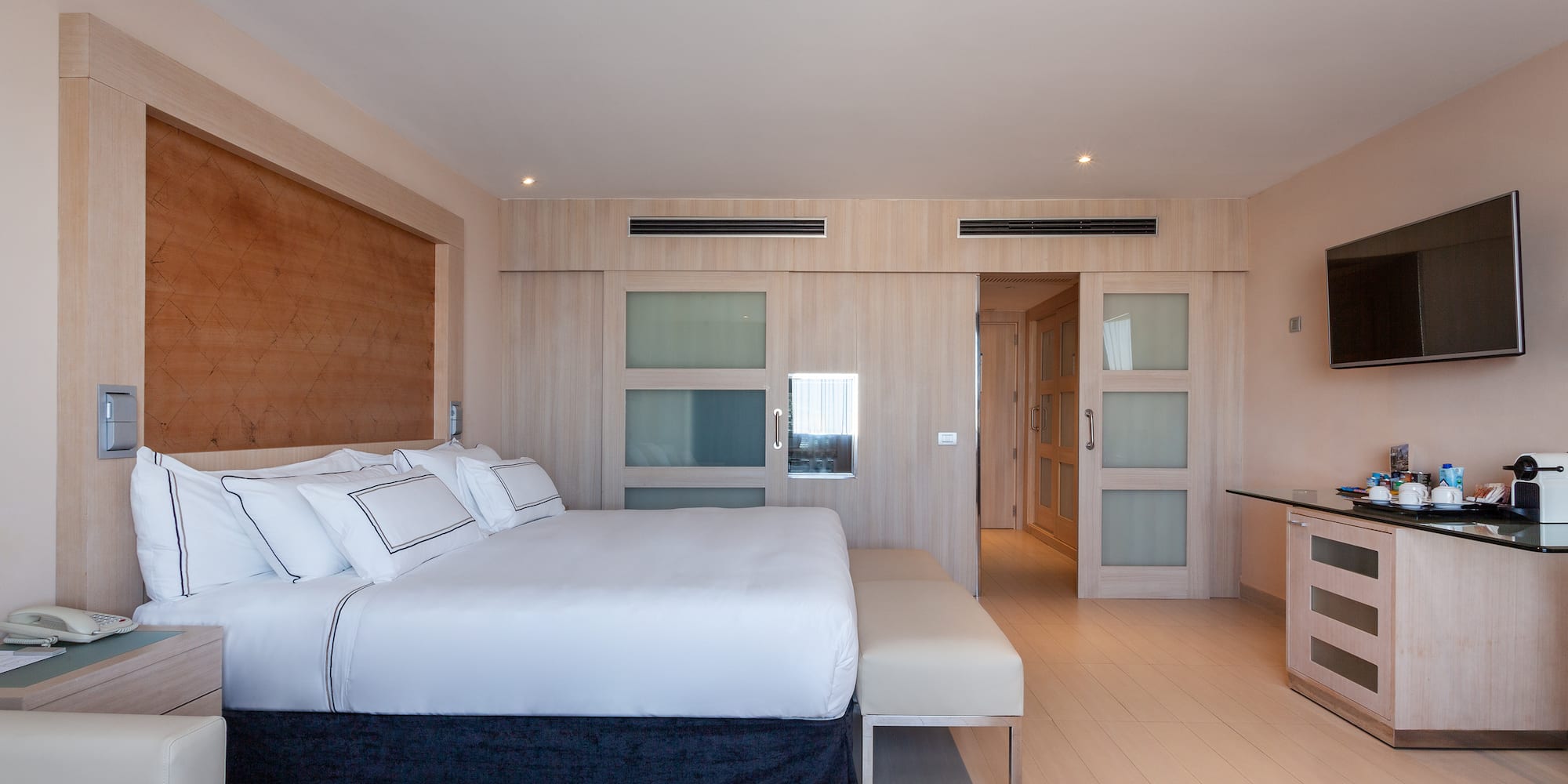 a bedroom with a bed and a table