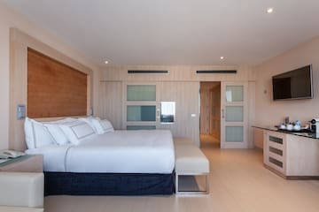 a bedroom with a bed and a table