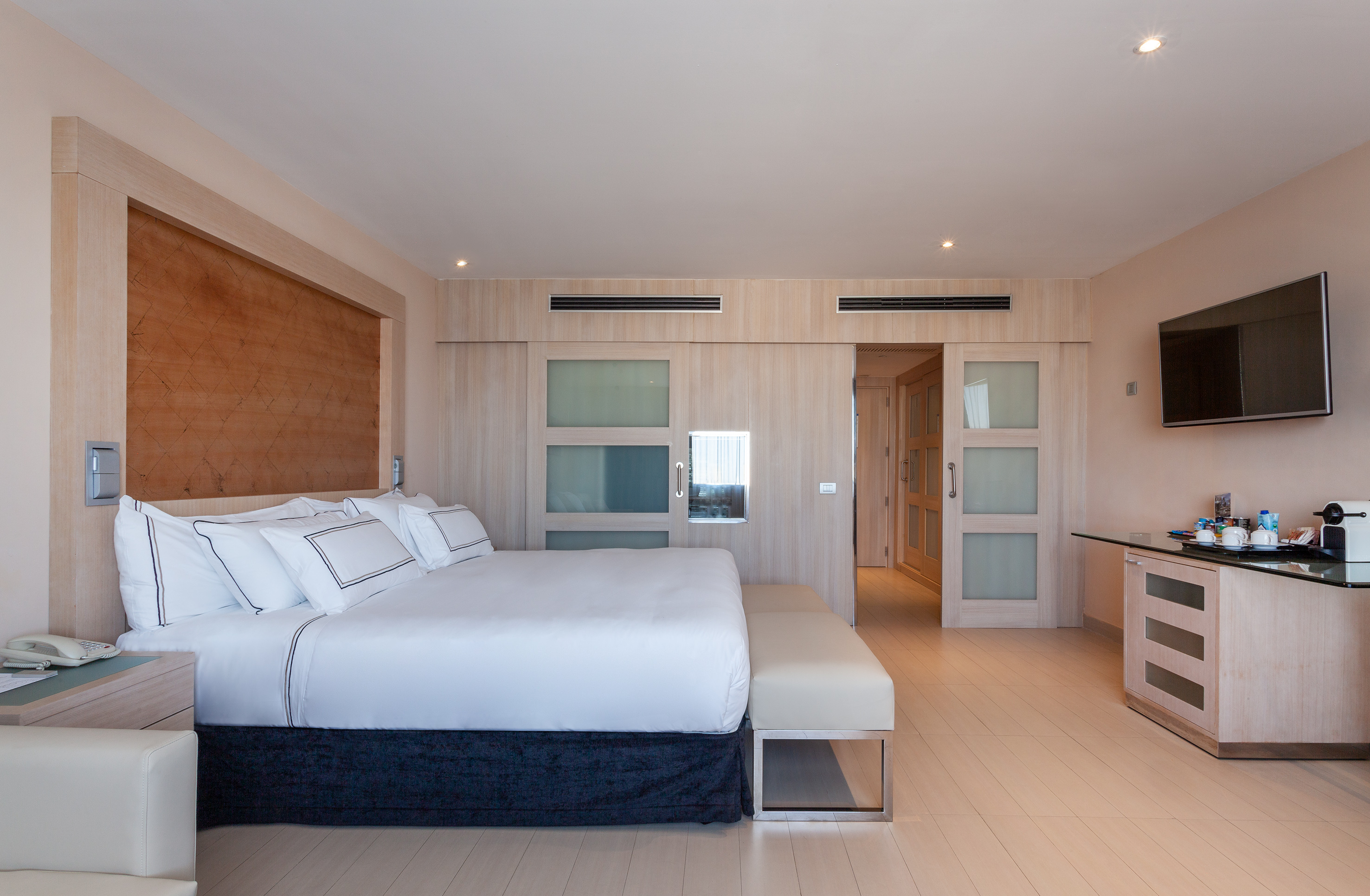 a bedroom with a bed and a table