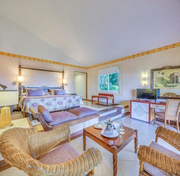 a room with a bed and a television