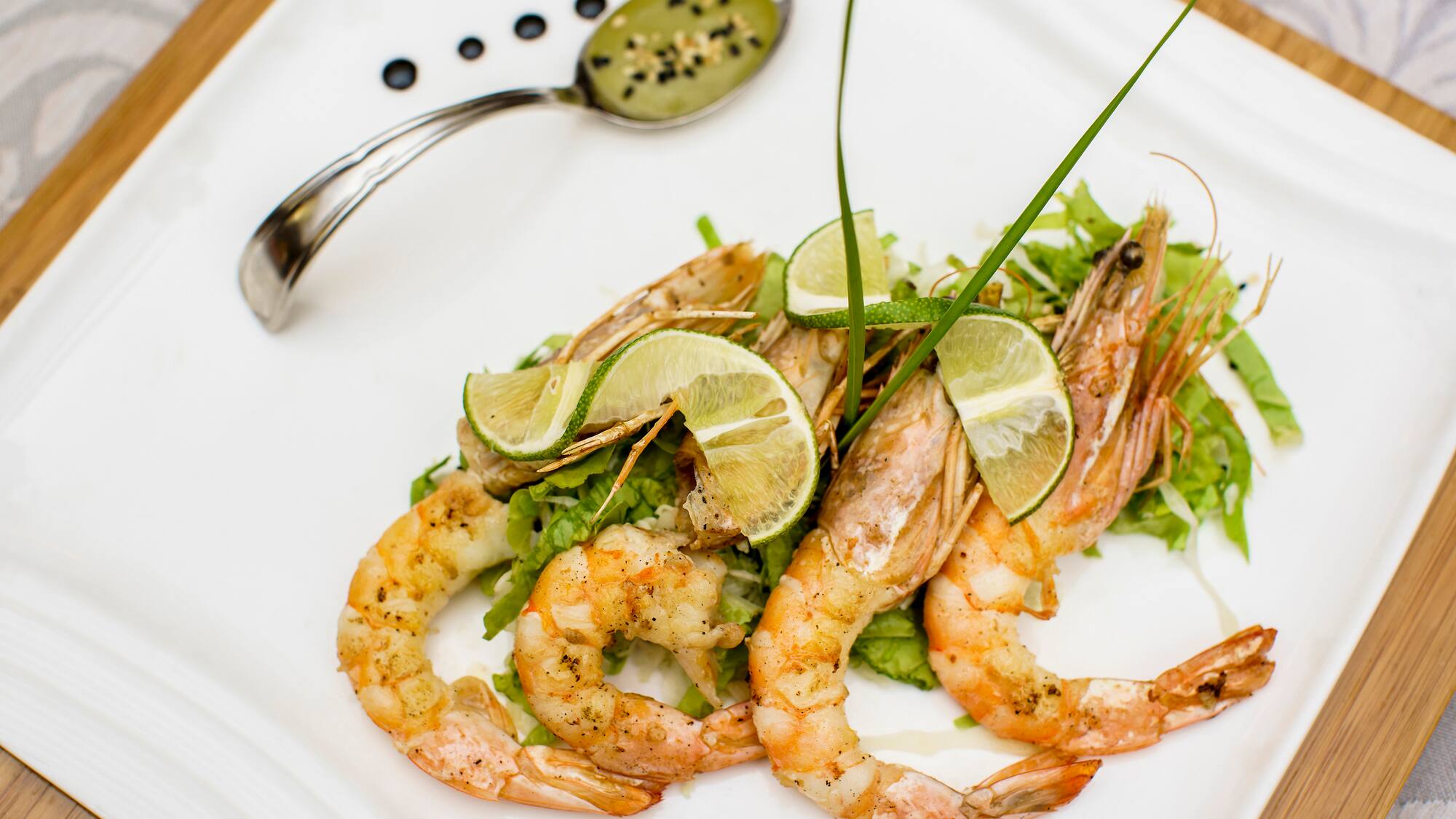 a plate of food with a spoon and a spoon