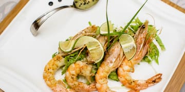 a plate of food with a spoon and a spoon