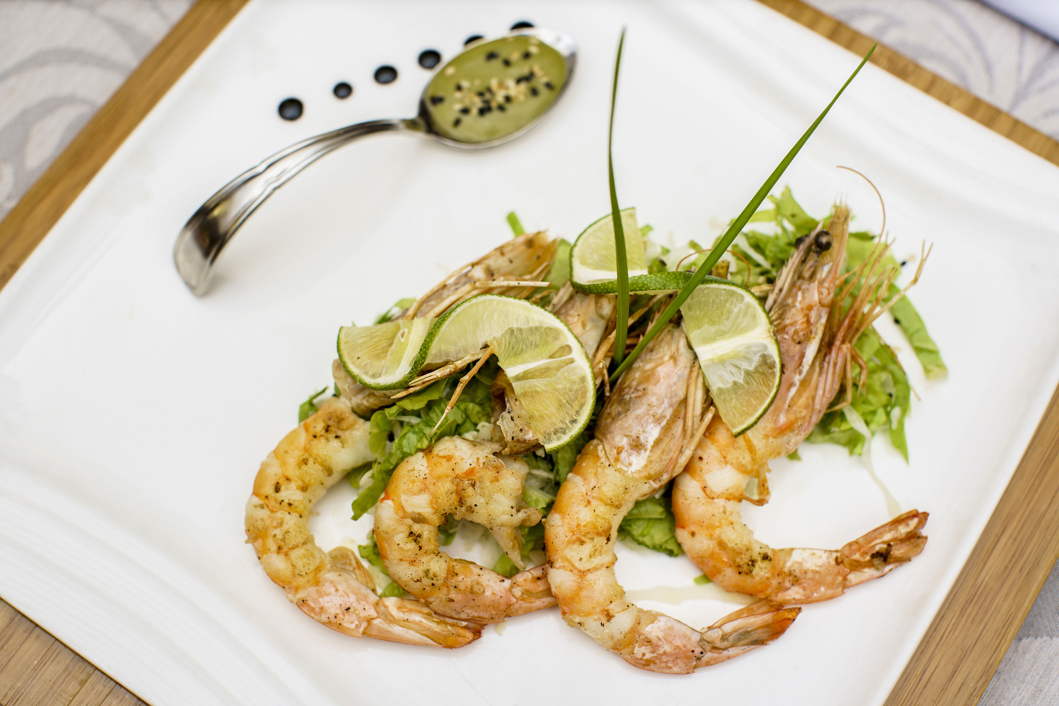 a plate of food with a spoon and a spoon