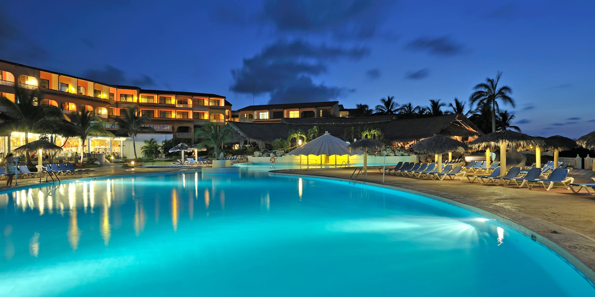 a pool with a building in the background