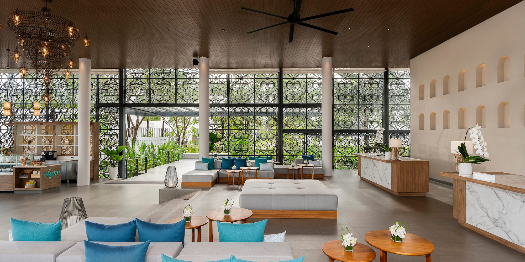 a room with a large window and a large ceiling fan