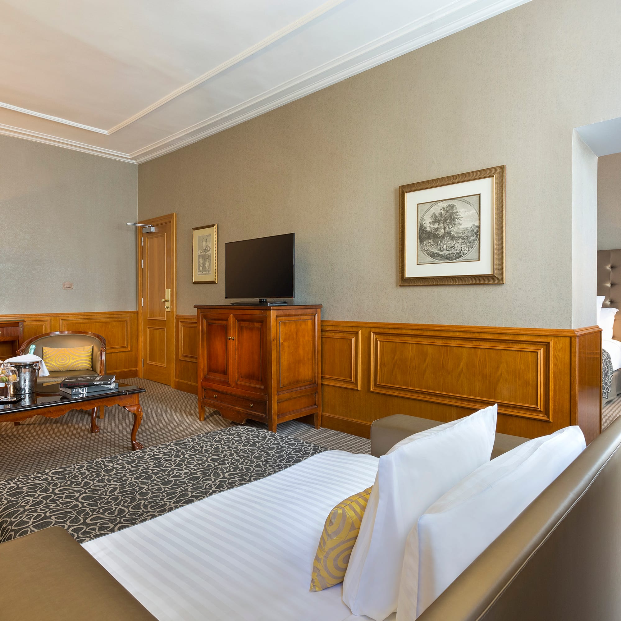 a room with a bed and a television