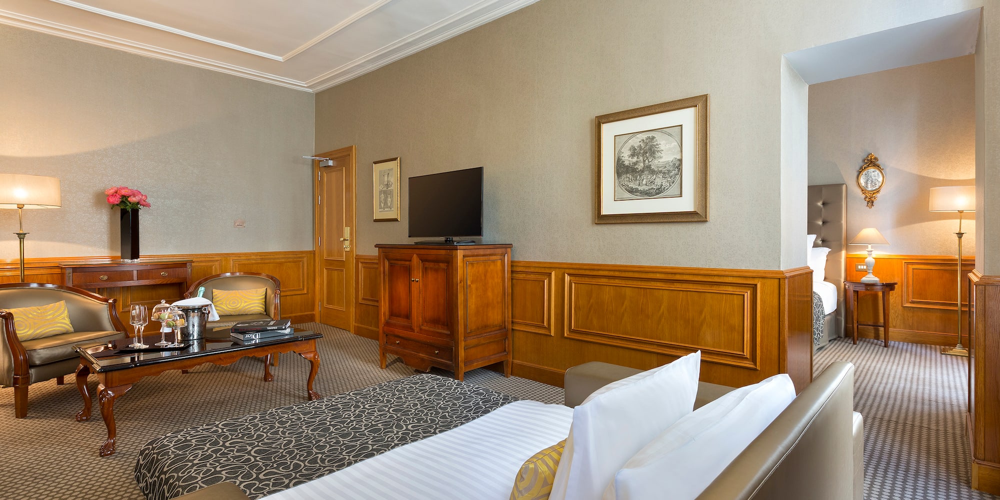 a room with a bed and a television