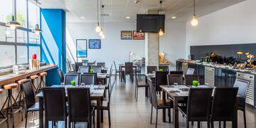 a room with tables and chairs