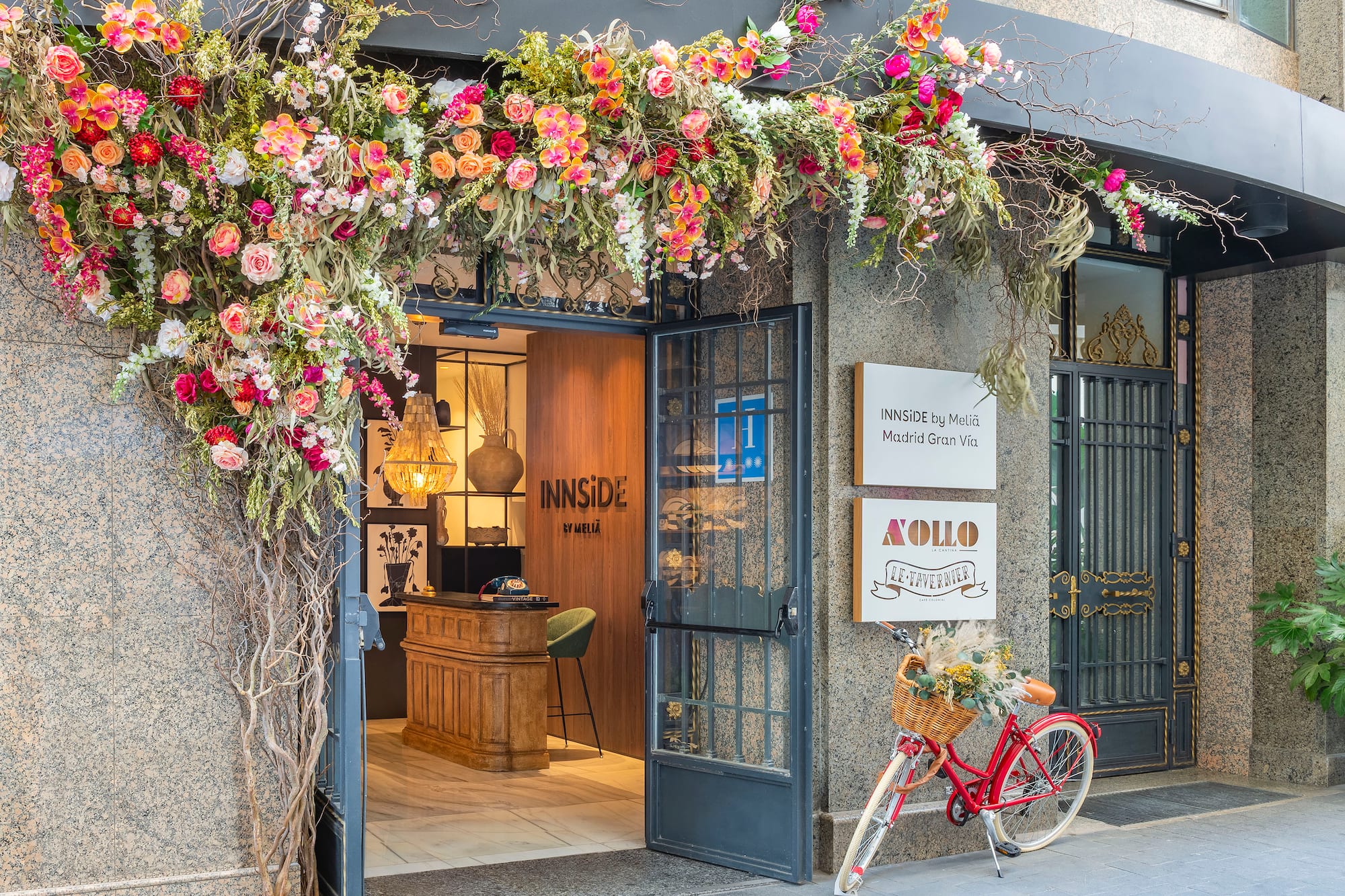 a flower covered entrance to a building