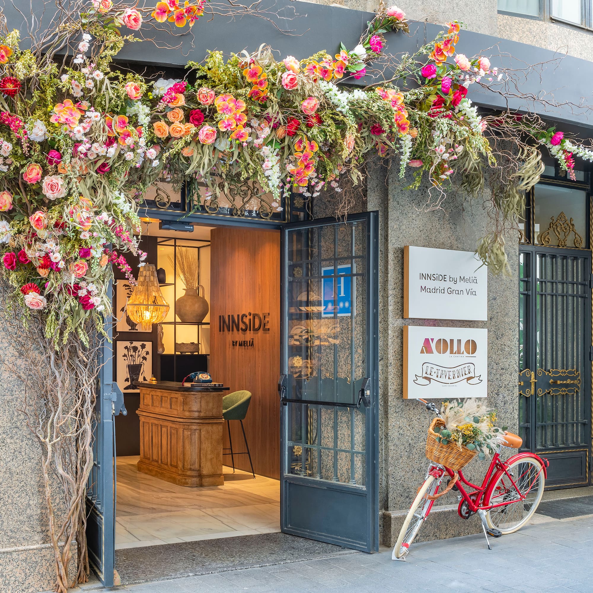a flower covered entrance to a building