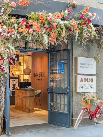 a flower covered entrance to a building