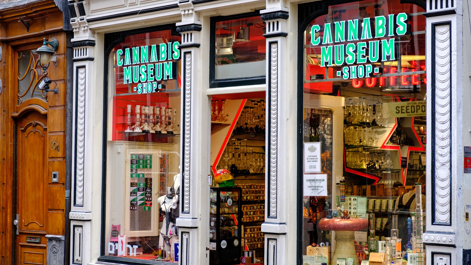 a store front with signs on windows