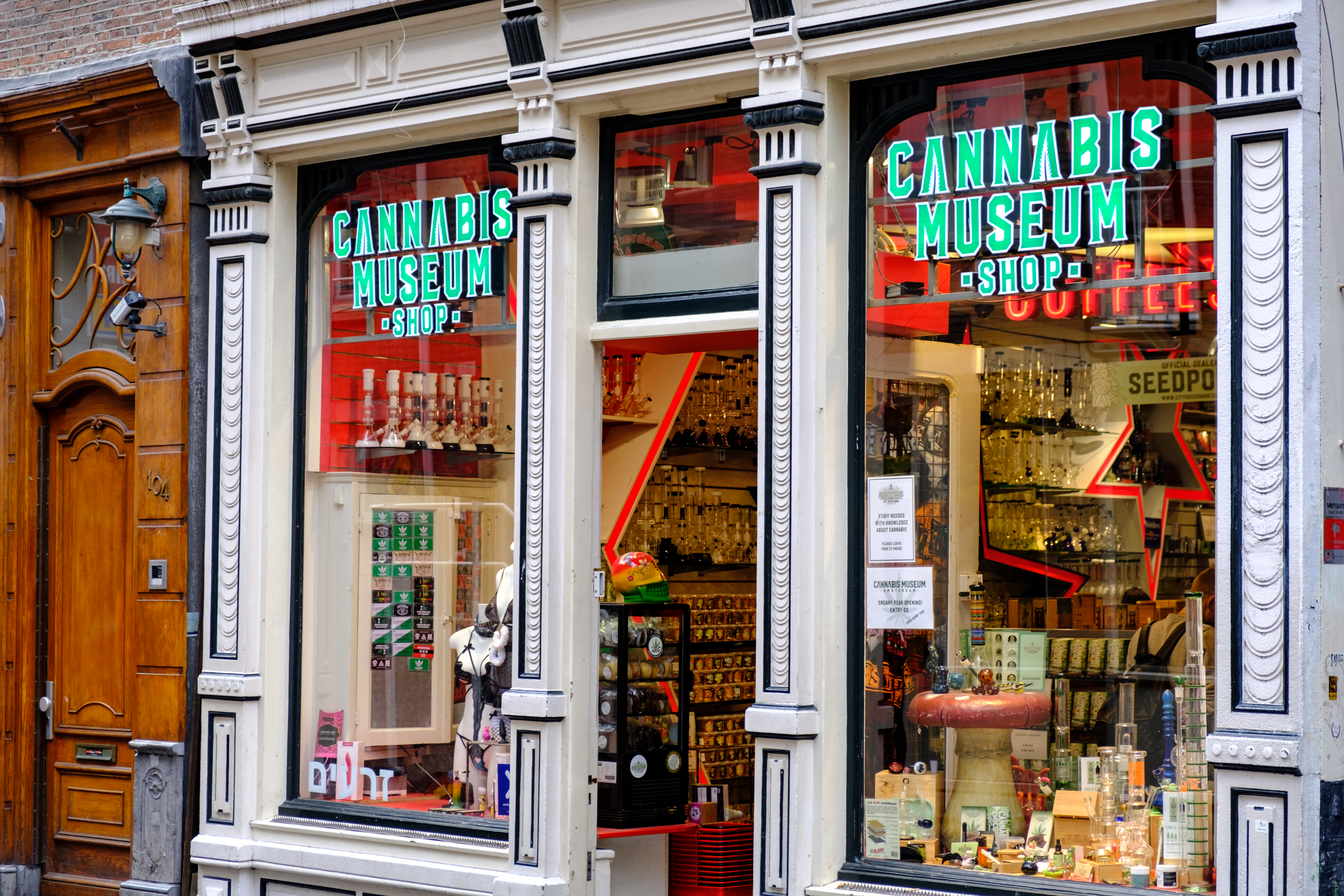 a store front with signs on windows