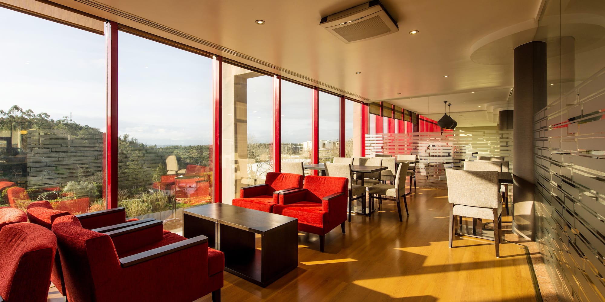 a room with red chairs and tables