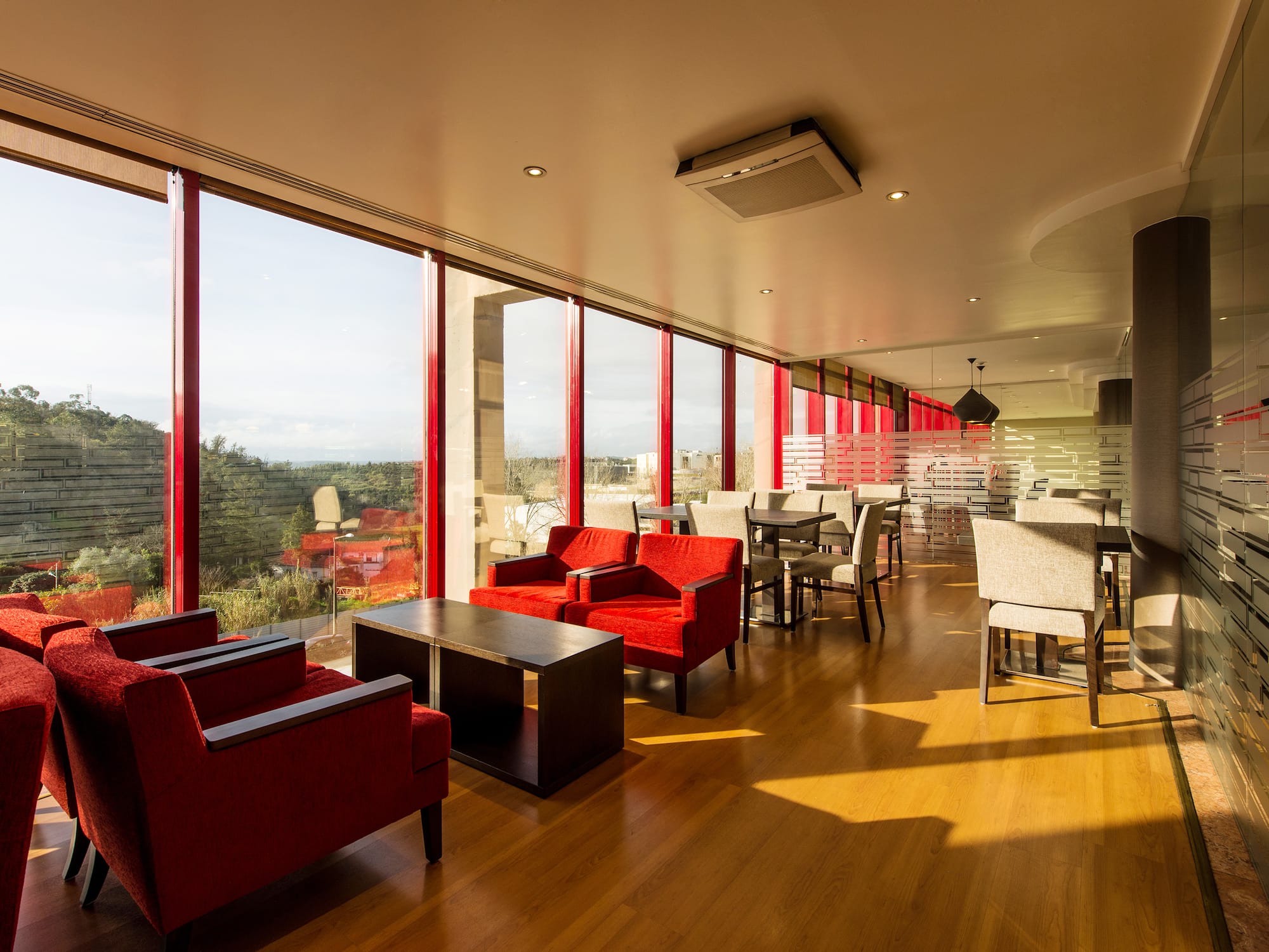 a room with red chairs and tables