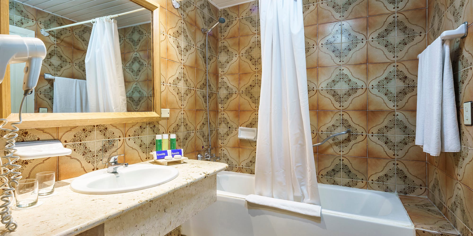 a bathroom with a bathtub and sink