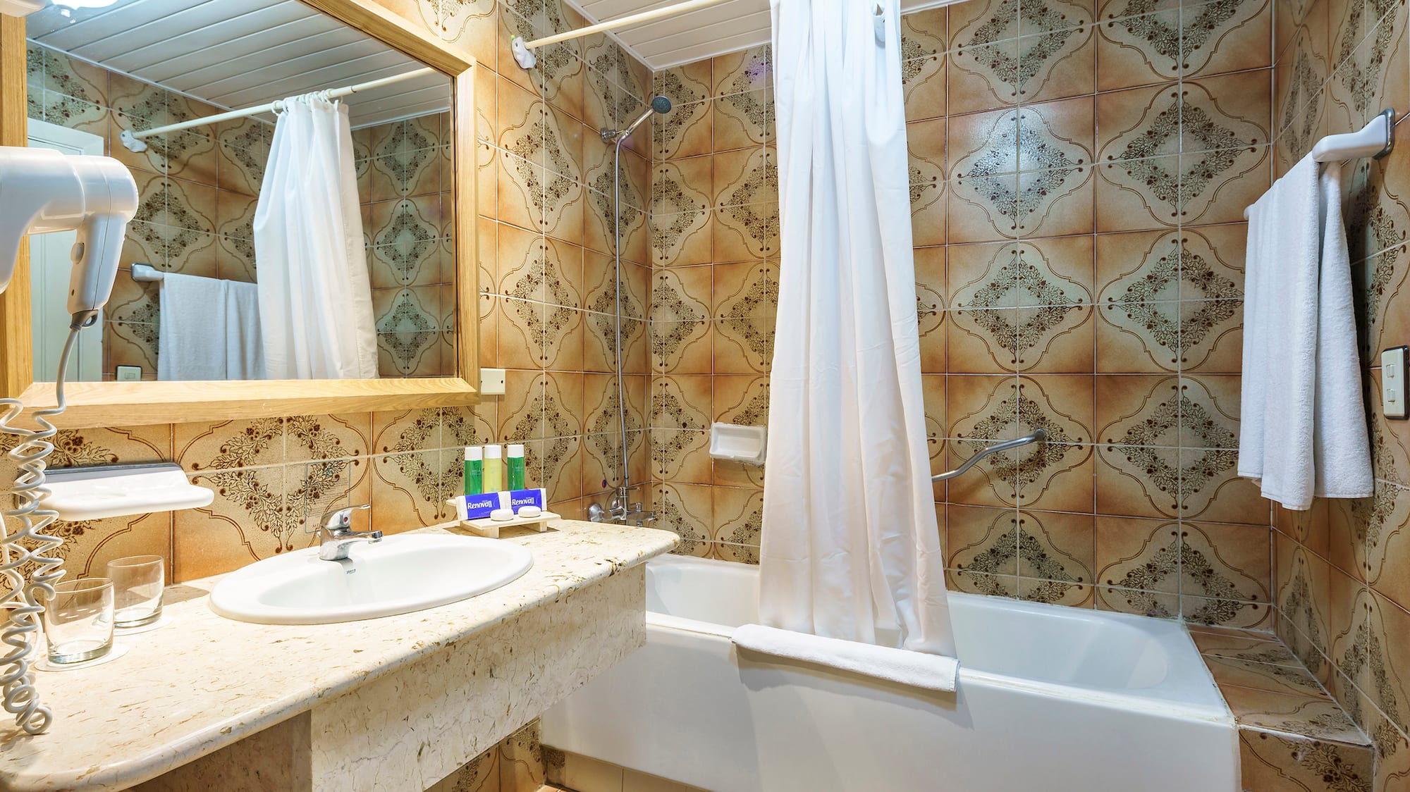 a bathroom with a bathtub and sink