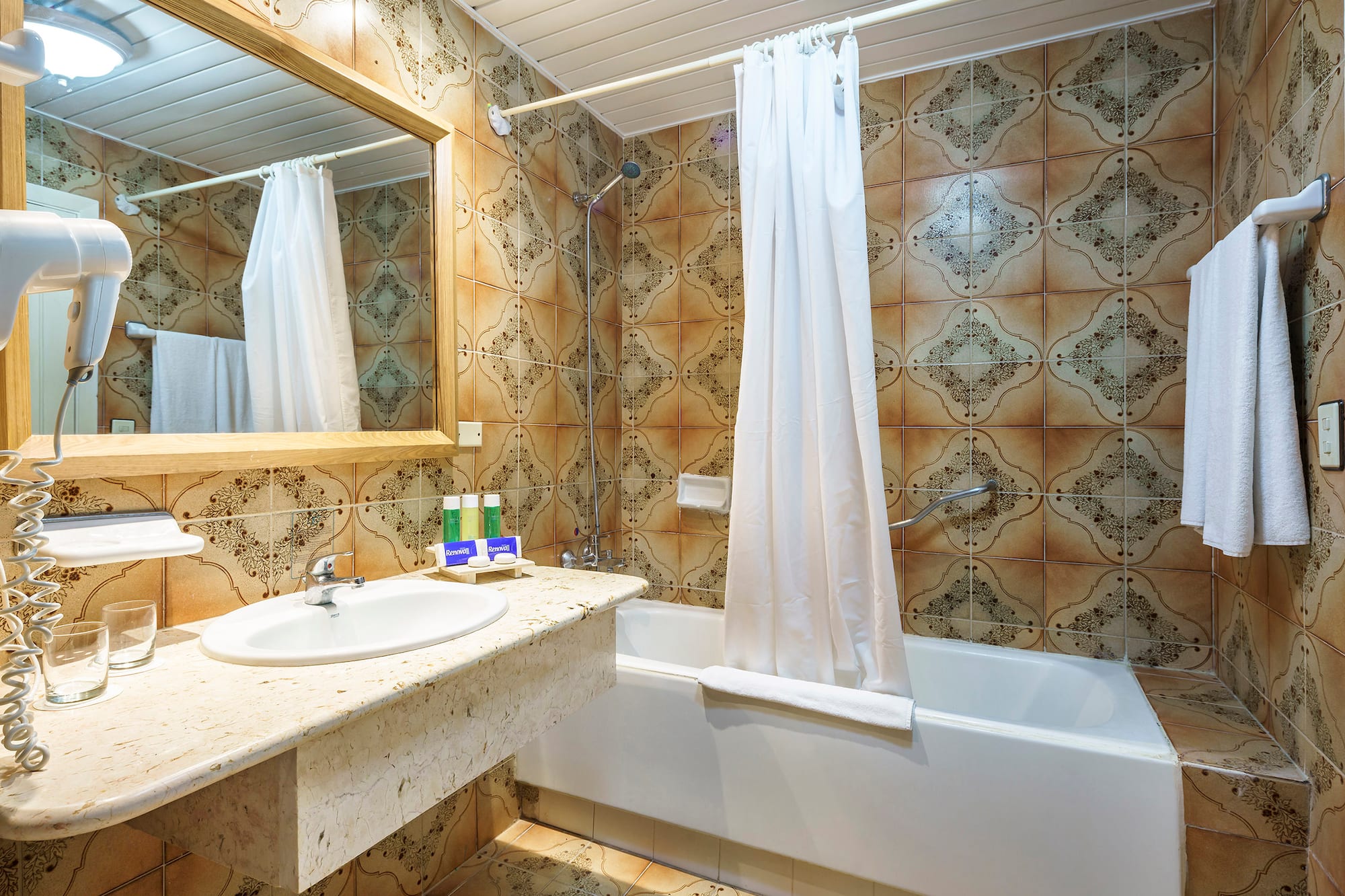 a bathroom with a bathtub and sink