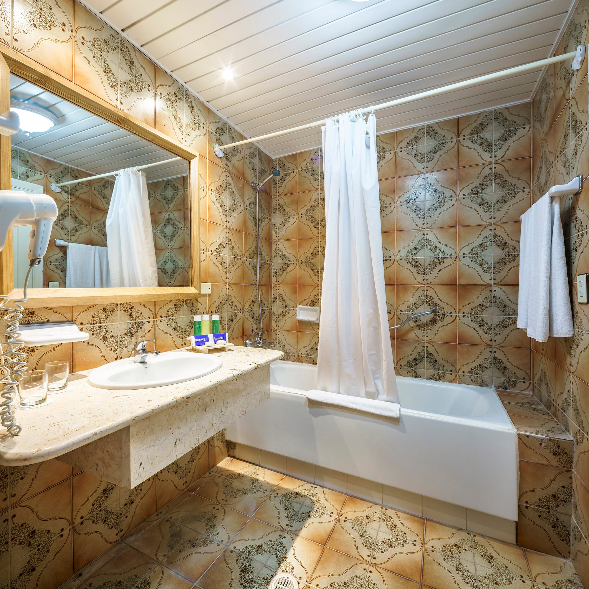 a bathroom with a bathtub and sink