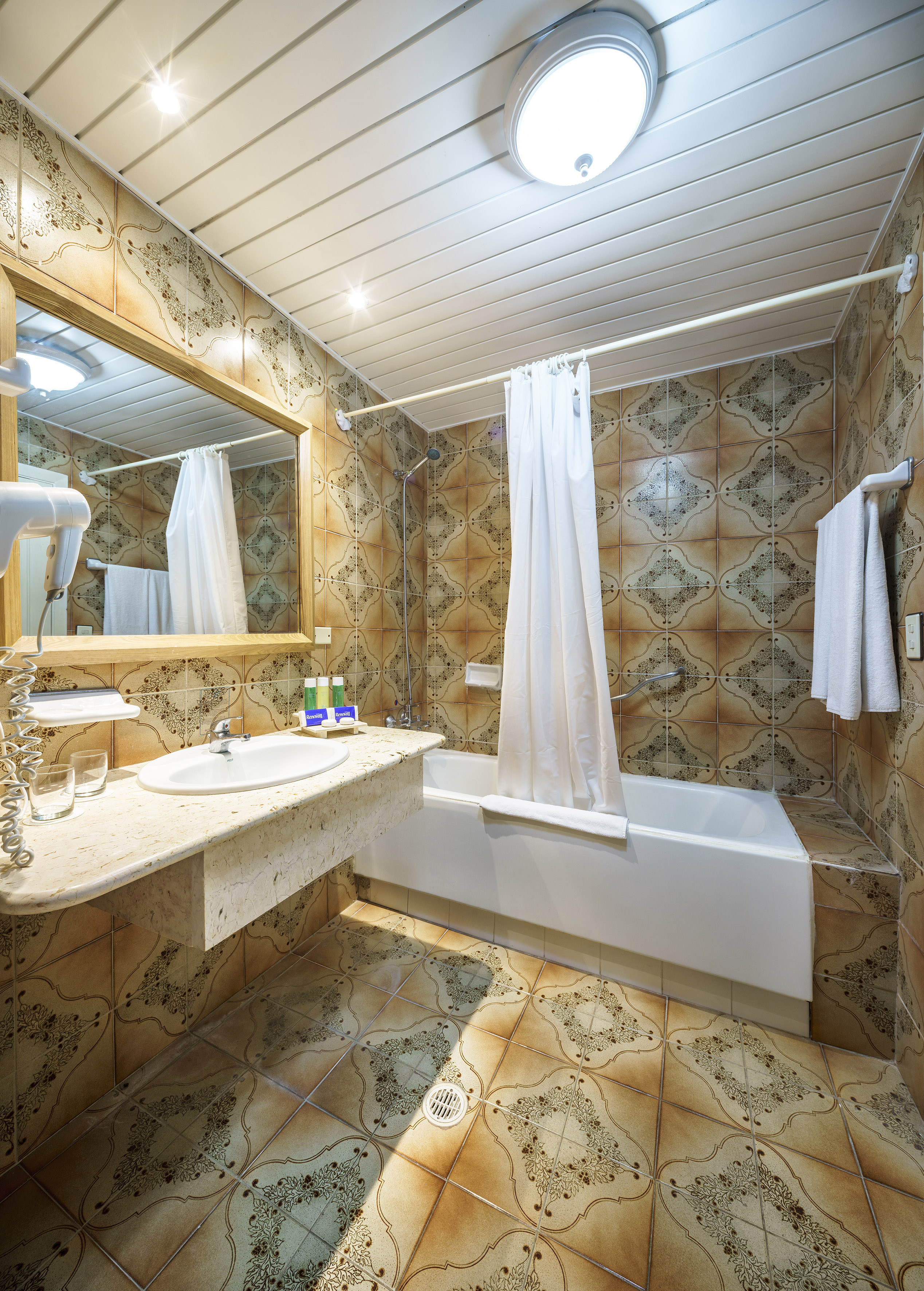 a bathroom with a bathtub and sink