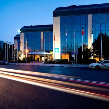 a car driving on a road next to a building