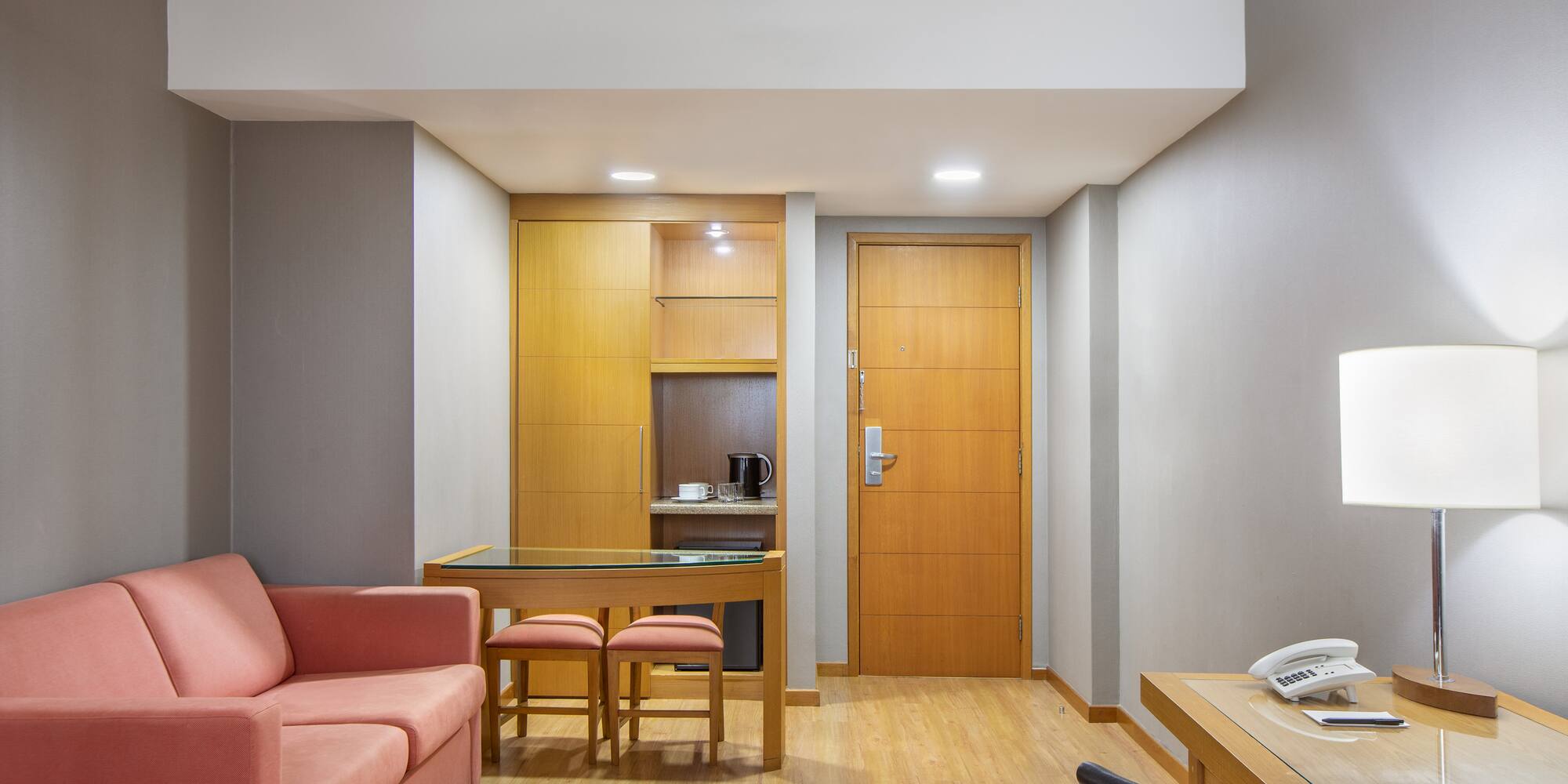 a room with a couch and a desk