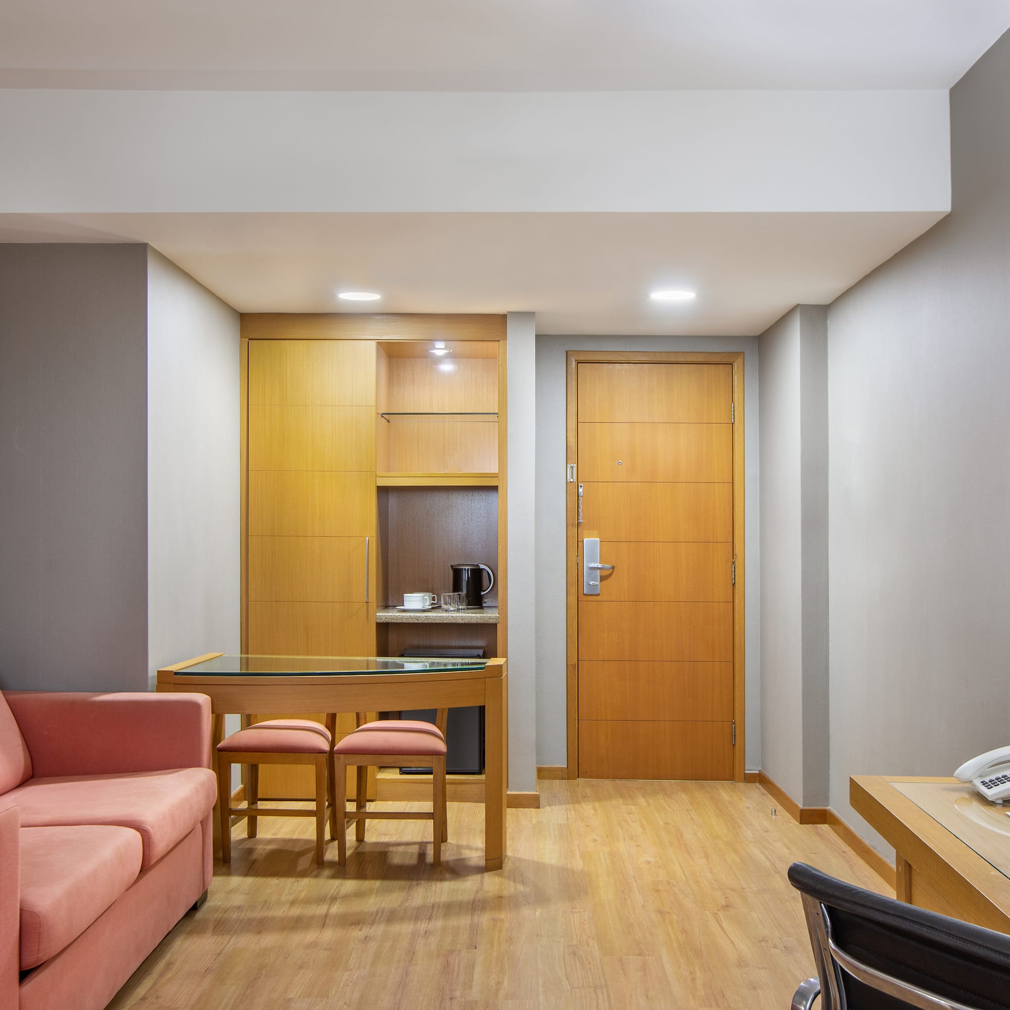 a room with a couch and a desk