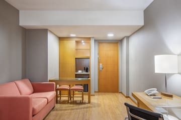 a room with a couch and a desk