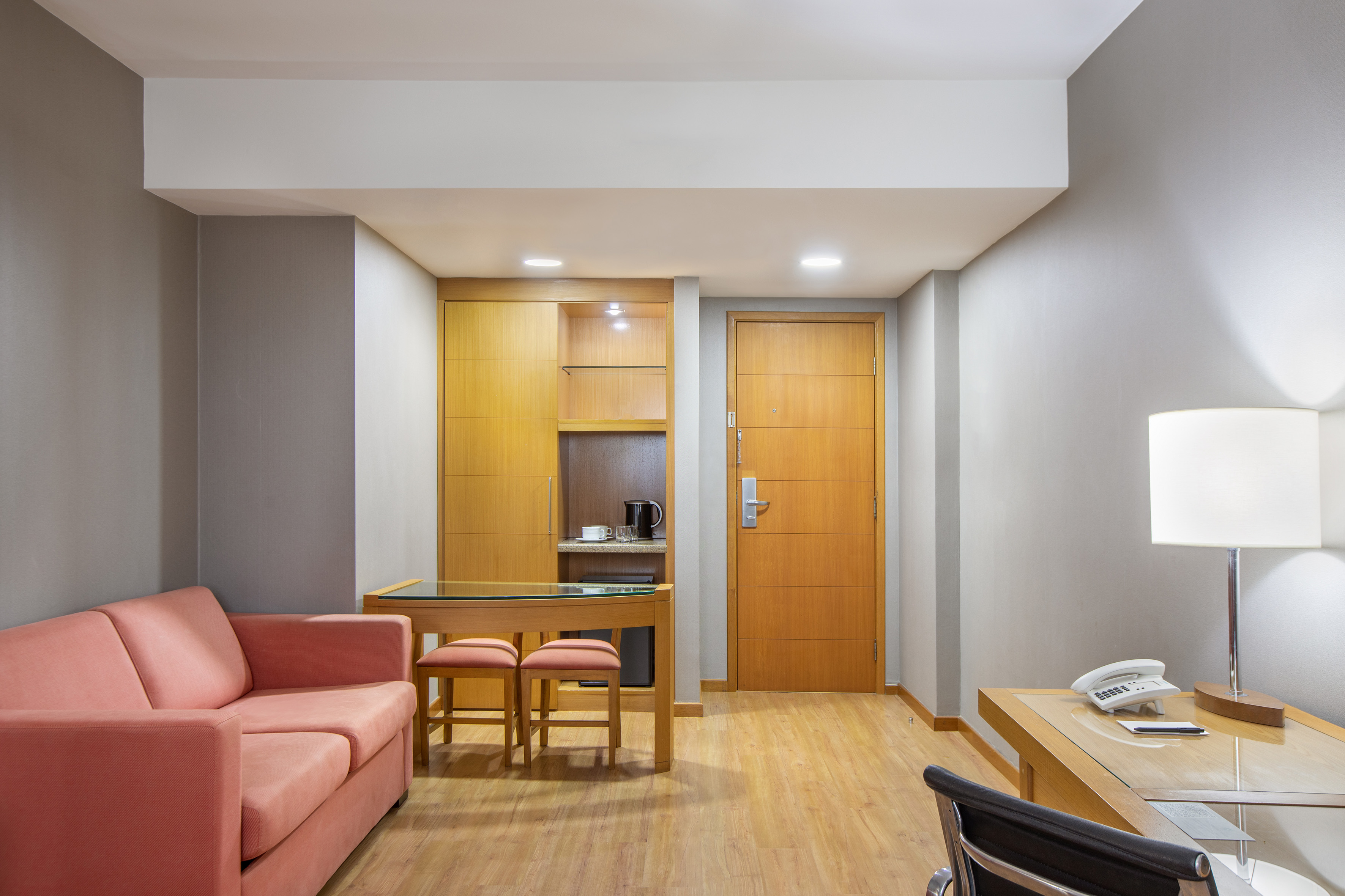 a room with a couch and a desk