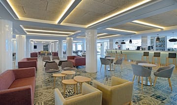 a room with chairs and tables