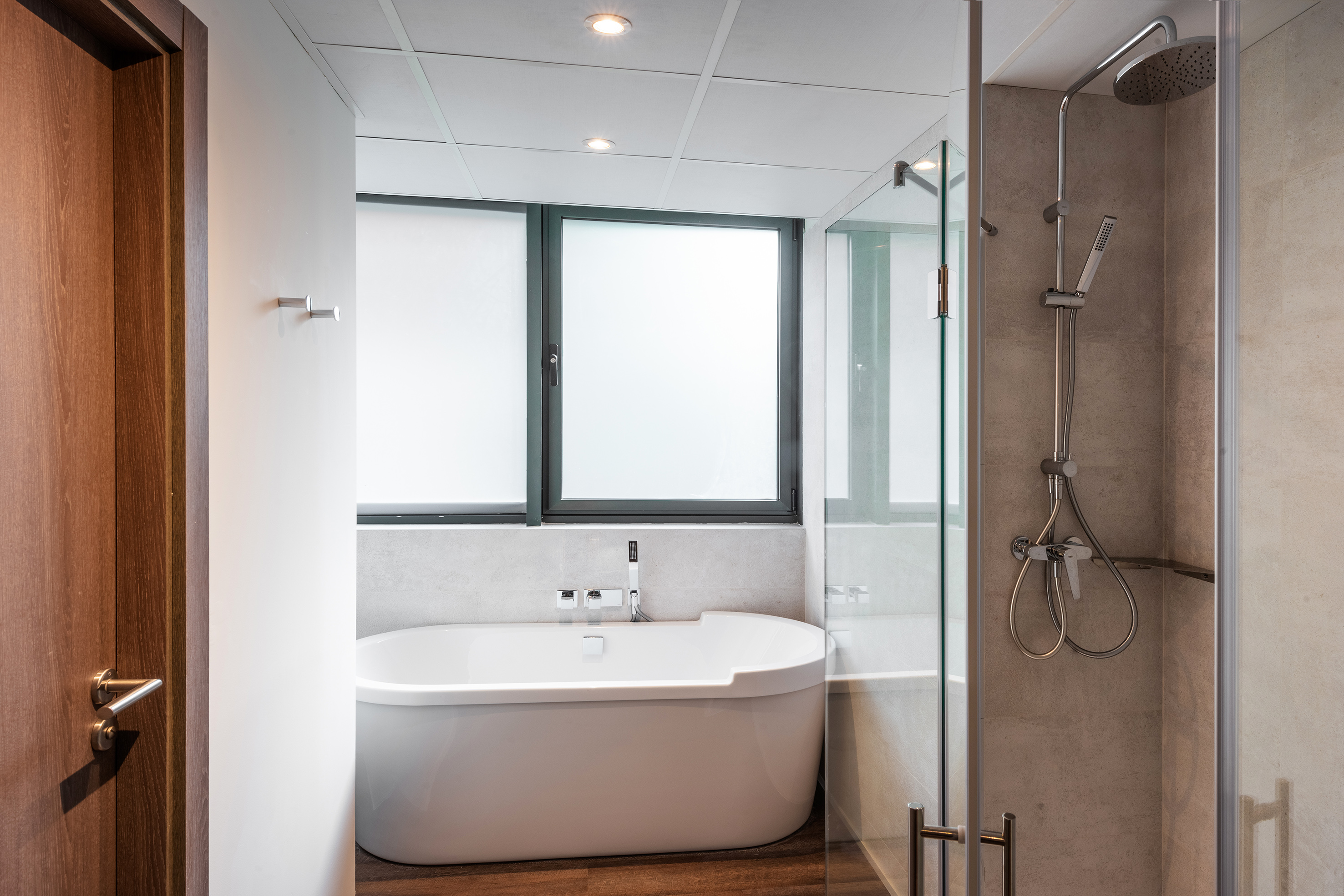 a bathroom with a tub and shower