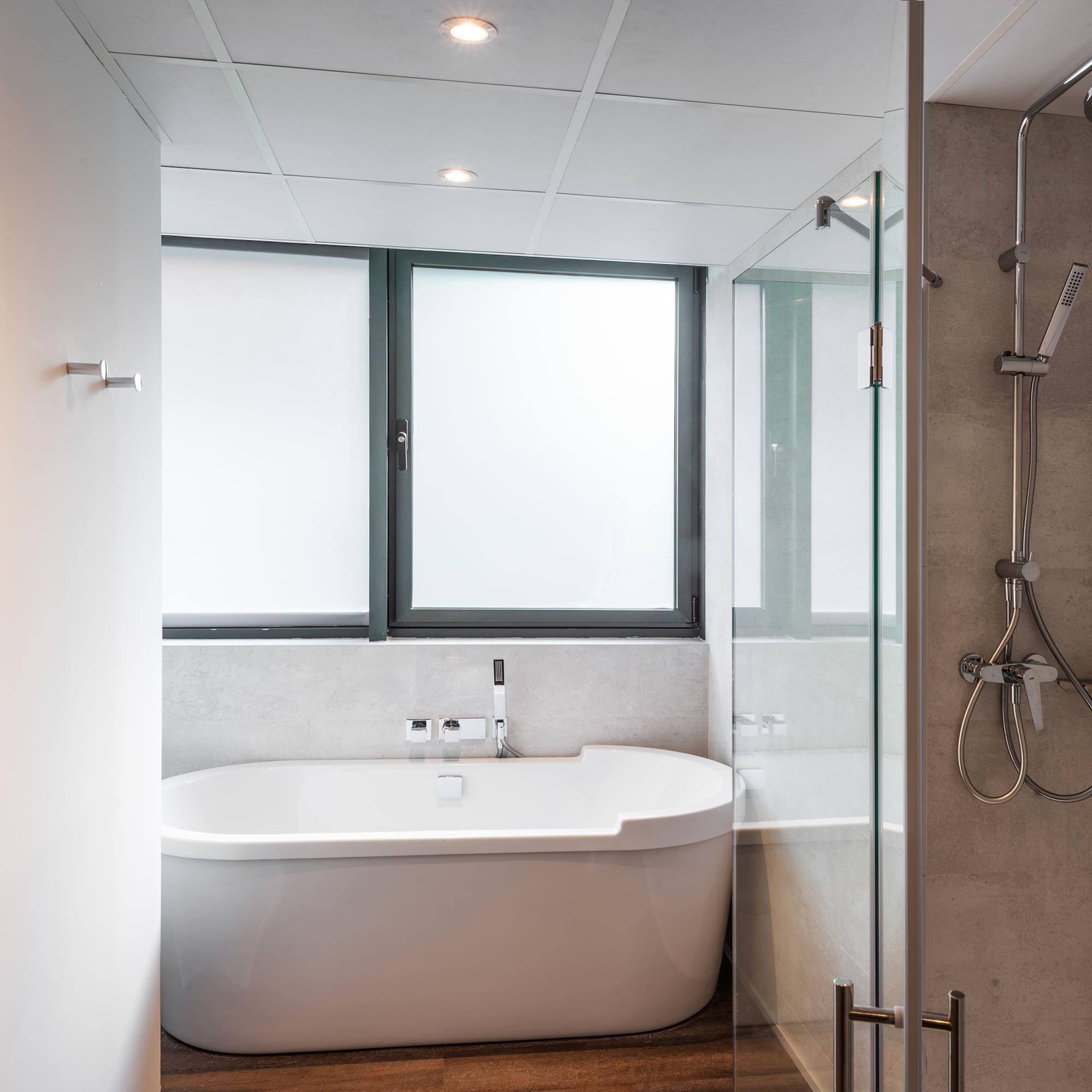 a bathroom with a tub and shower
