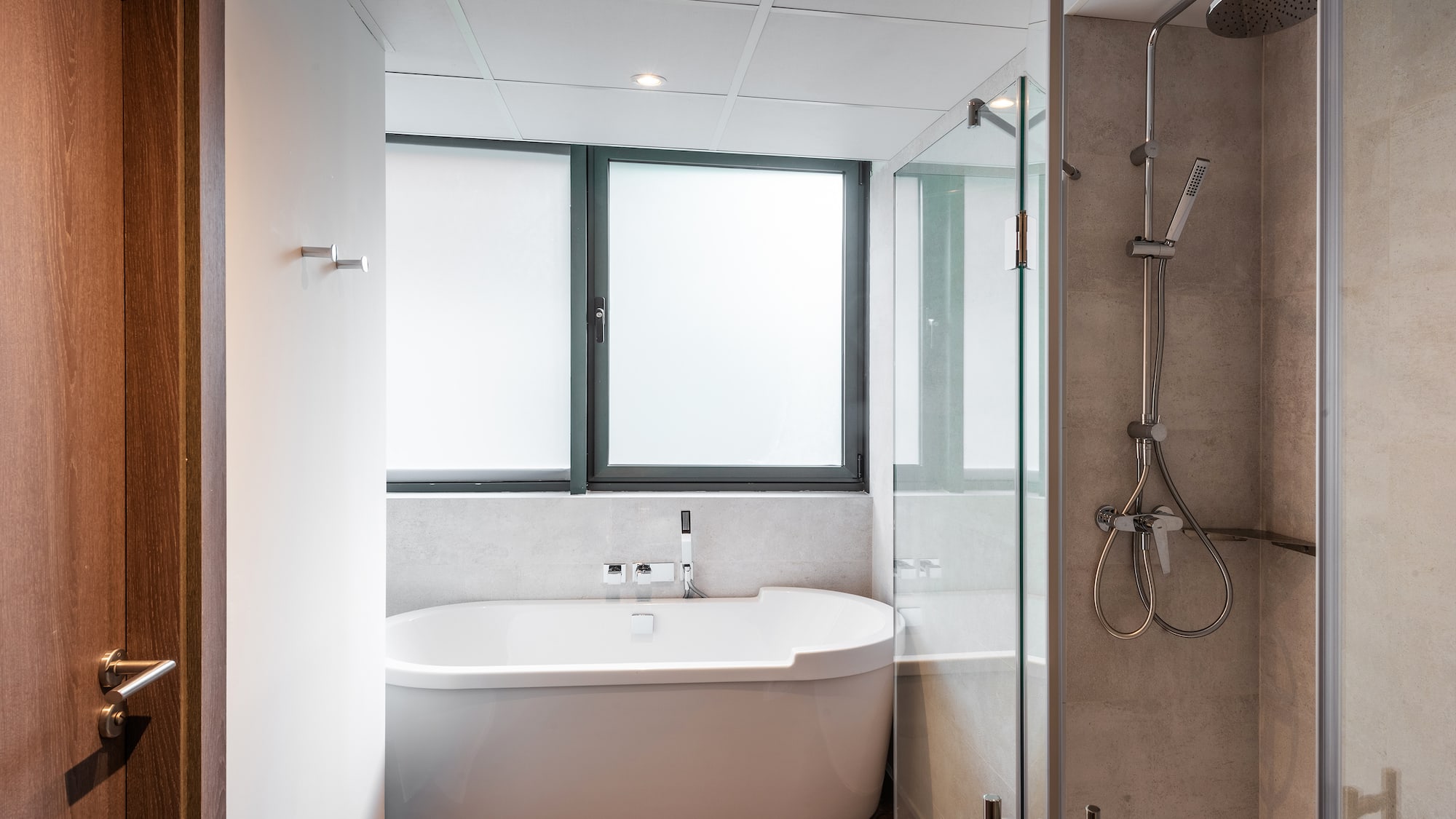 a bathroom with a tub and shower