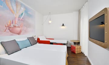 a room with two beds and a table