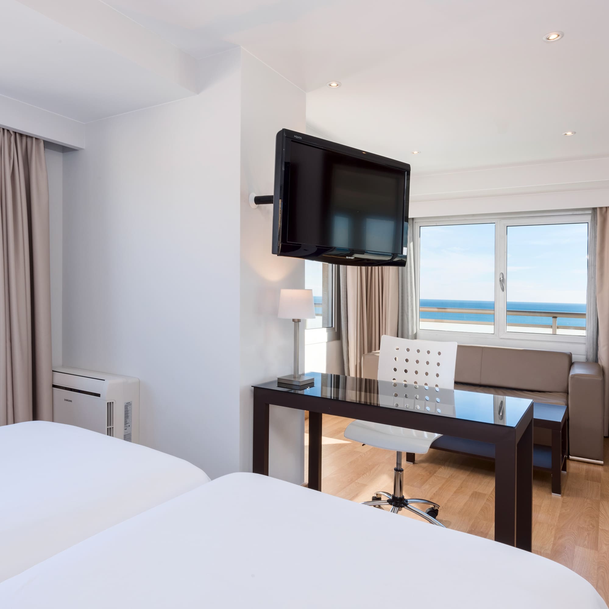 a room with a television mounted on the wall